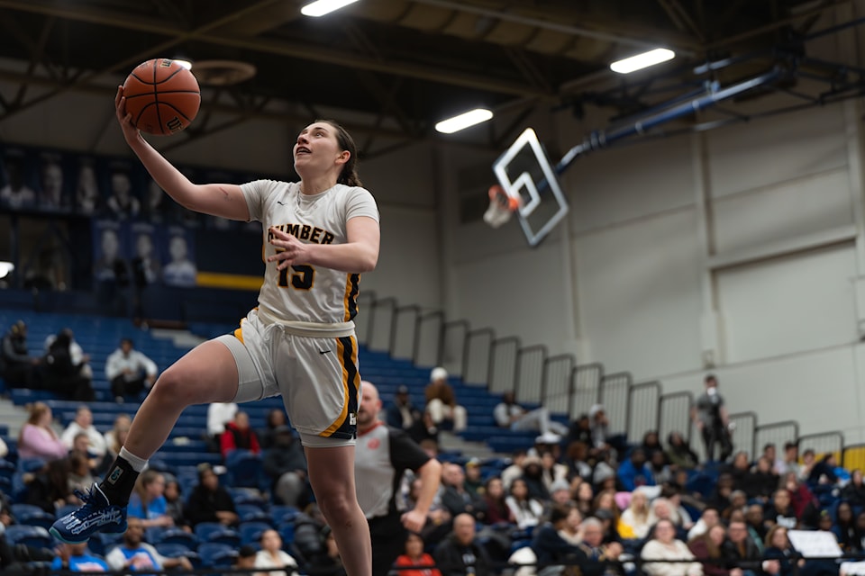 Sarah Baptie, number 15, going up for a layup. Baptie had a historic night after recording 8 steals, a new program record for steals in a postseason game.