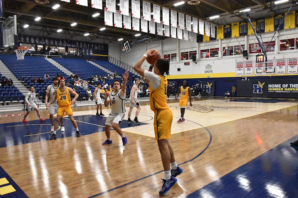 Humber Hawks point guard Isaiah Brady-Clarke about to throw a triple during Humber’s game against the Canadore Panthers on Feb. 2