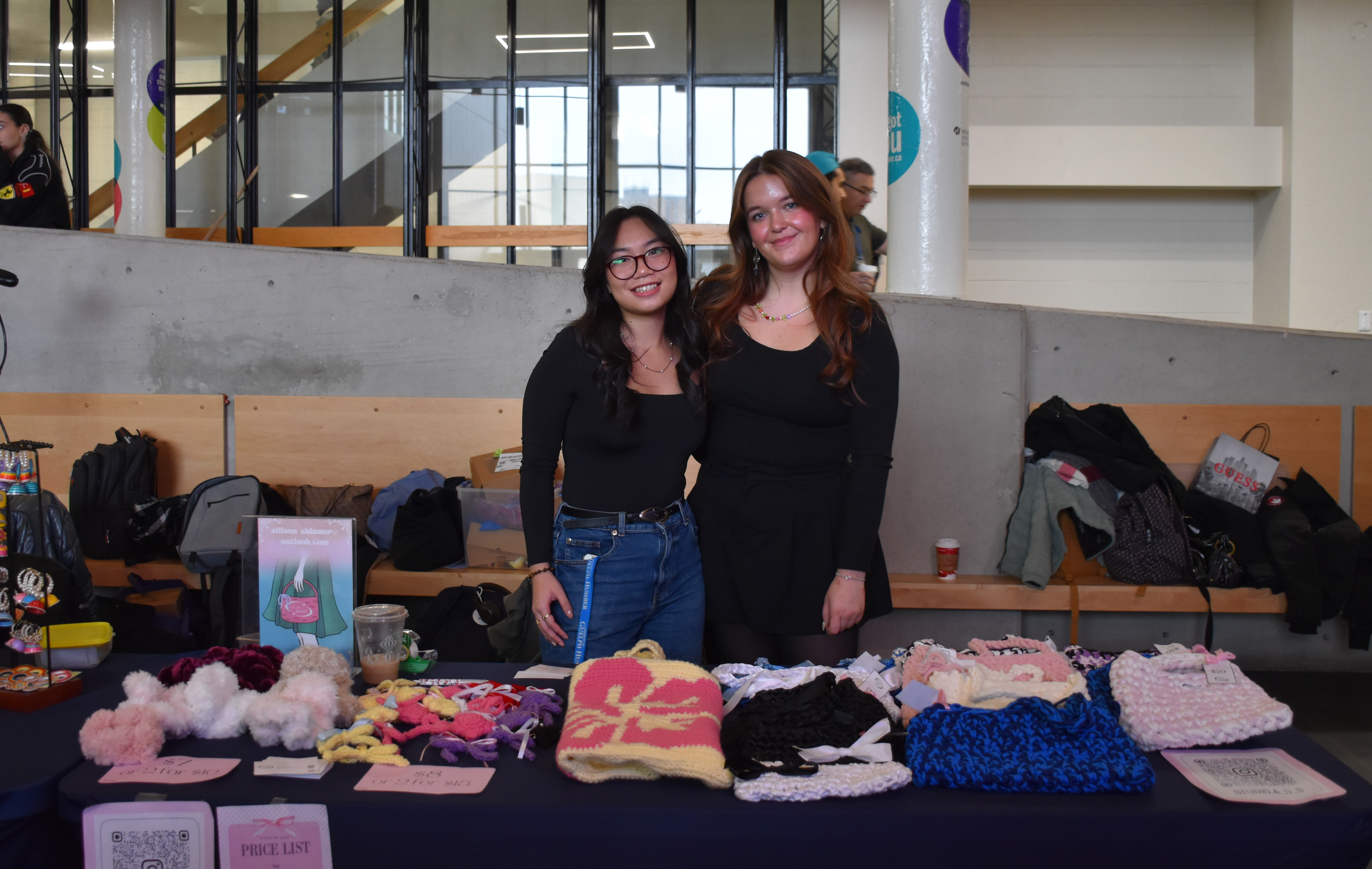 Two women selling clothing.