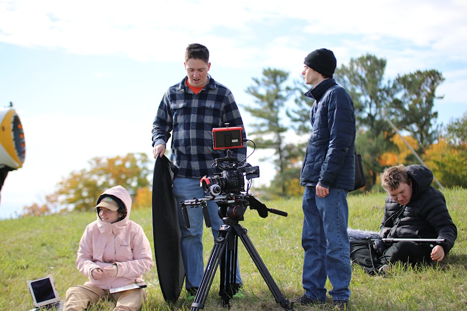 group-filming-shot-on-hill