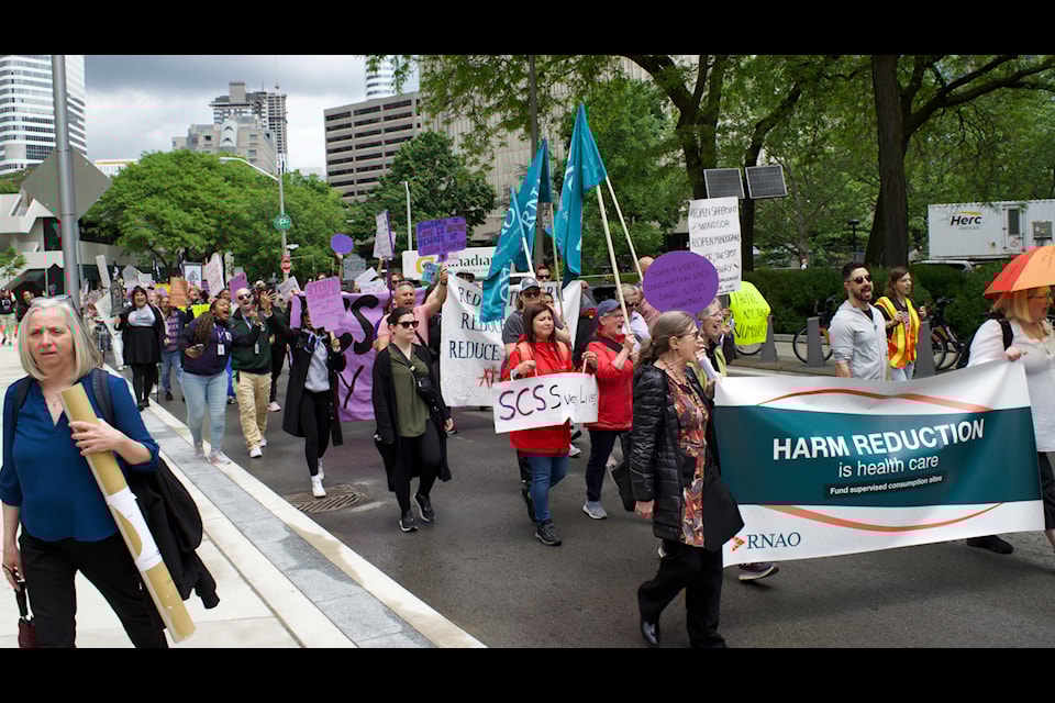 Frontline workers and advocates of safe consumption sites marched towards Queen's Park on Tuesday.