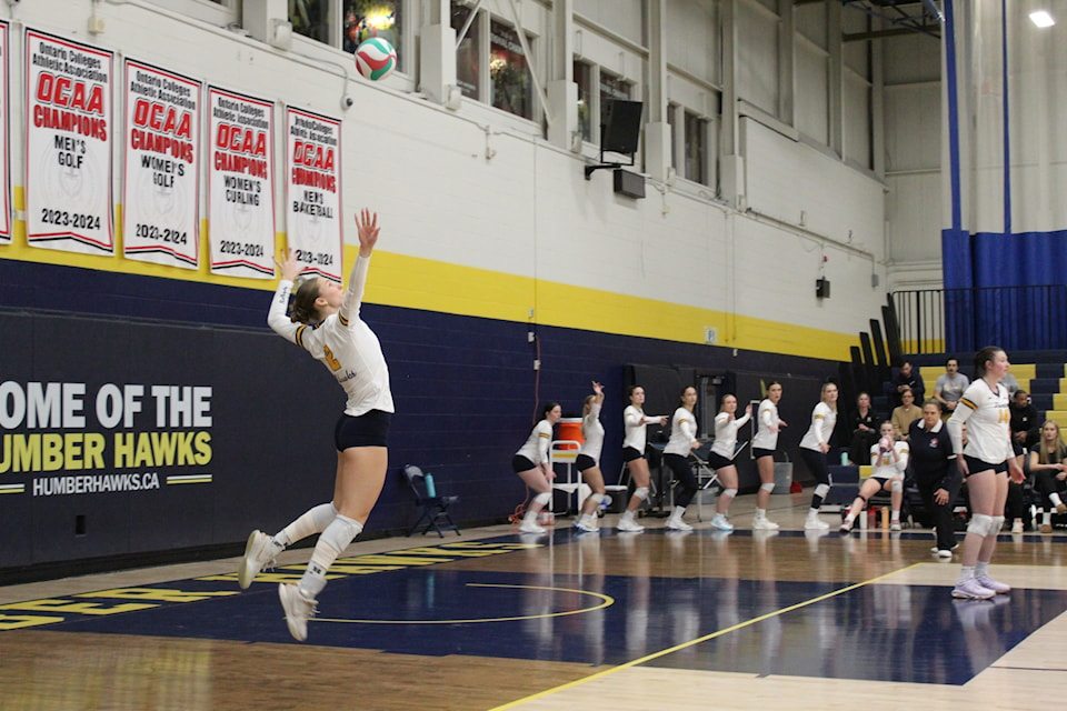 #2 Kennedy Williscroft going for the over-hand serve against Conestoga Condors on Wednesday Jan. 15.