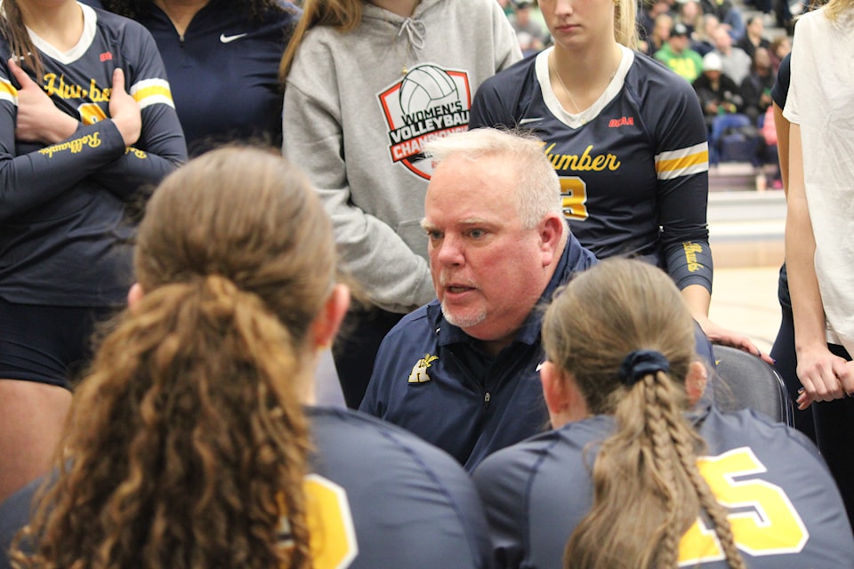 Chris Wilkins, Humber women’s volleyball team head coach talking to his team in a timeout during the final set of the OCAA bronze medal game against the St. Clair Saints on Feb. 22.