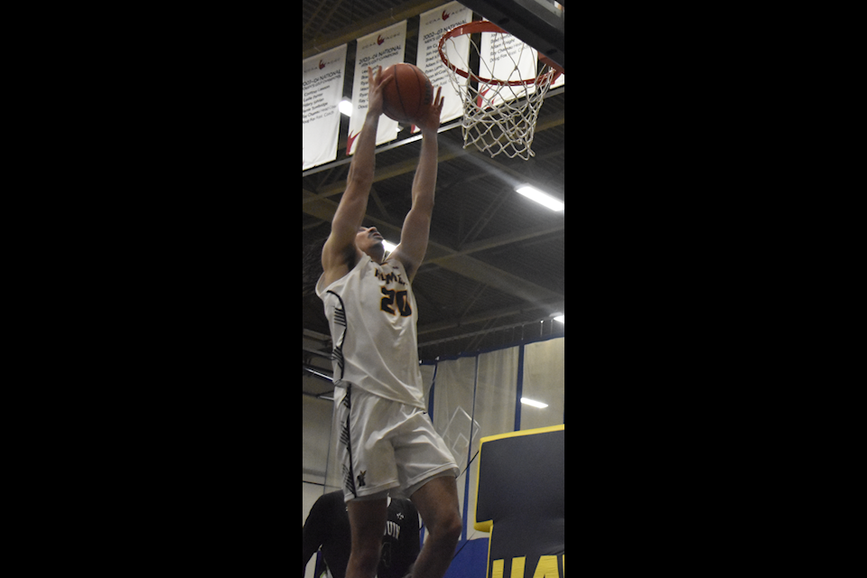Humber Hawks forward Lucas Lewis attempts a dunk against Algonquin on Feb. 23. 