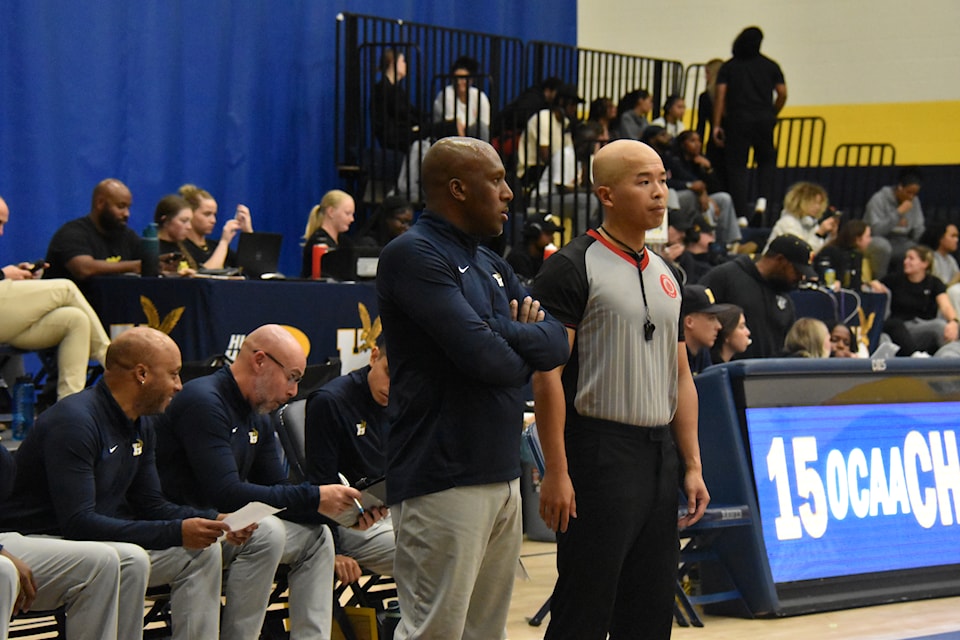 Humber Head Coach Omar Miles and his coaching staff overlooking the game against Mohawk.