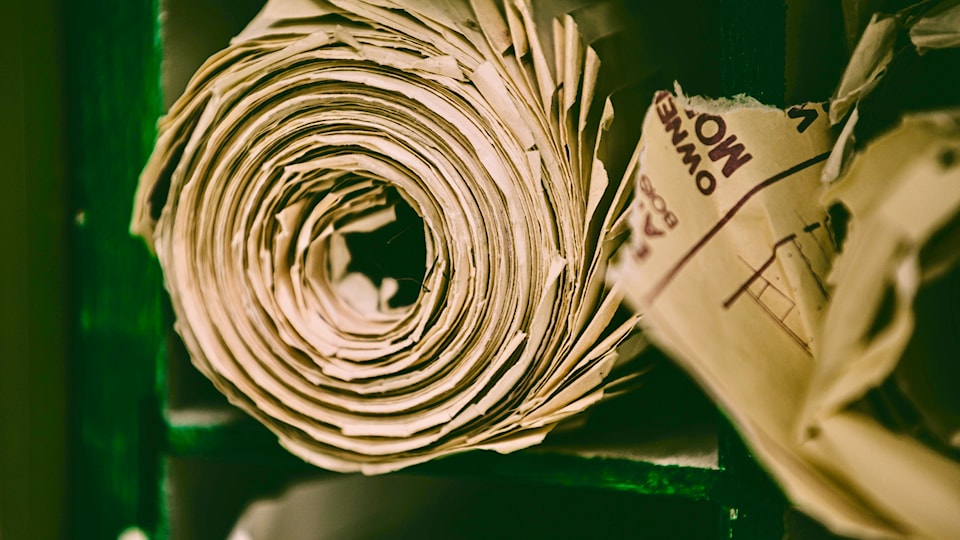 a-picture-of-a-roll-of-brown-paper-on-a-shelf-that-can-be-used-for-brown-paper-bags