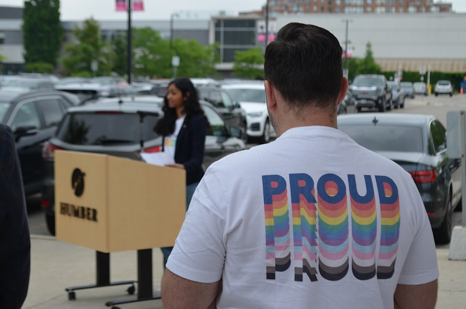 man-listens-to-pride-ceremony