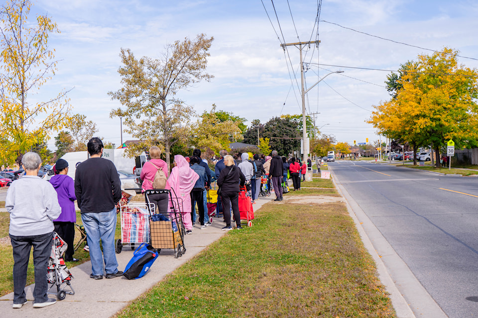 A lineup for a seasonal pop-up food bank outside Food Banks Mississauga.