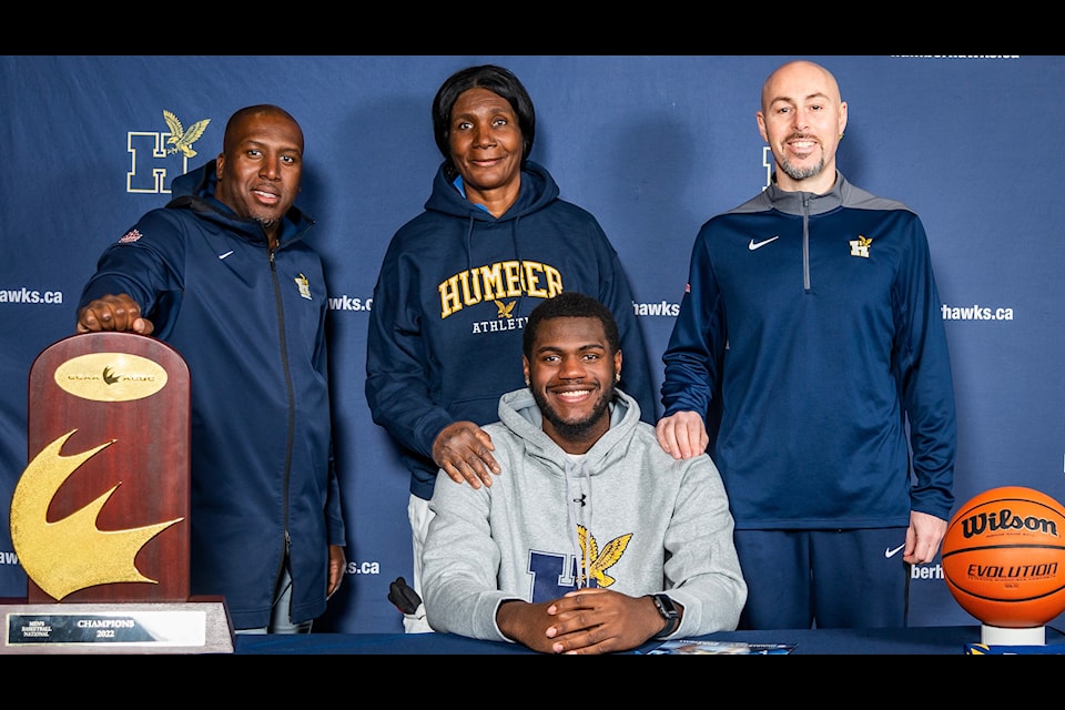 Jamani Barrett, with Humber Hawks Basketball staff.