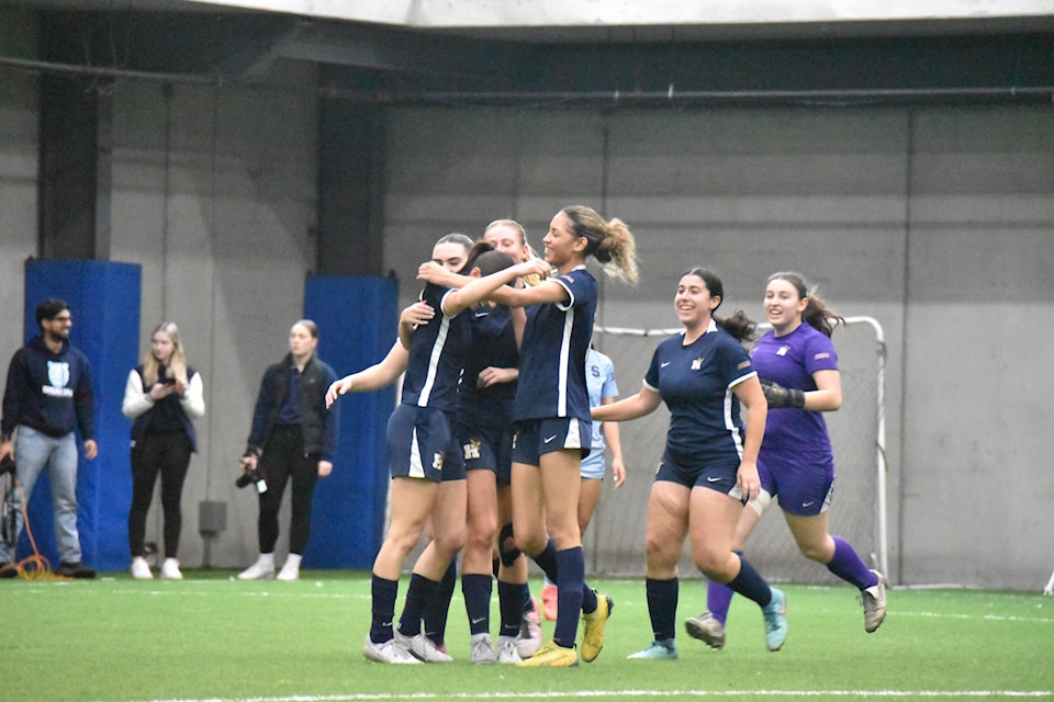 Humber players celebrating the team's second goal, which confirmed their qualification to the OCAA. semifinal on March 6