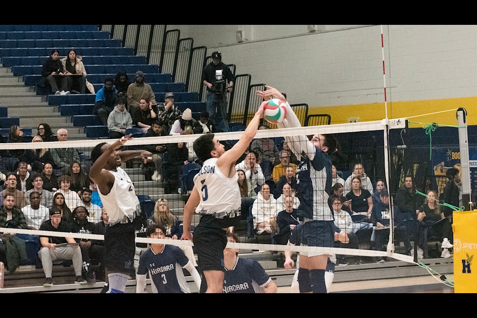 Josh Nicholson (5) spiking the ball over the net in a game against the Niagara Knights on Jan. 15, 2025.